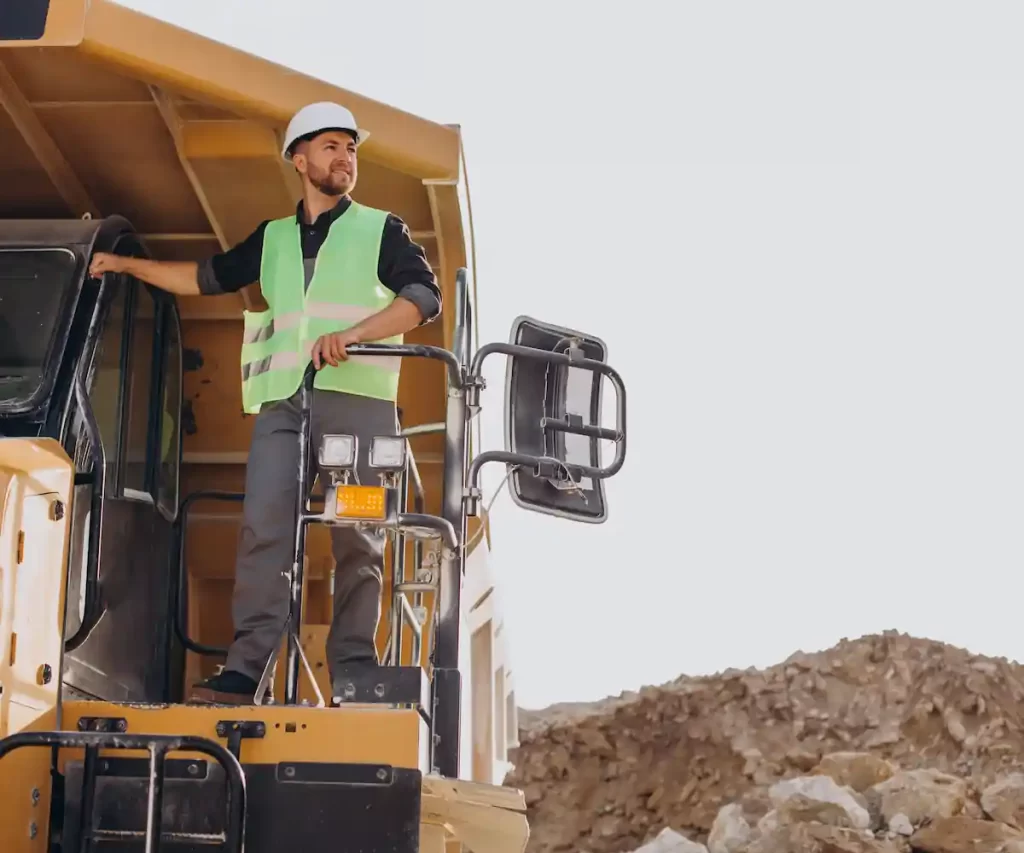 male worker with bulldozer sand quarry